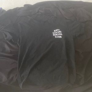 This is and anti social shirt and it is also slightly used.